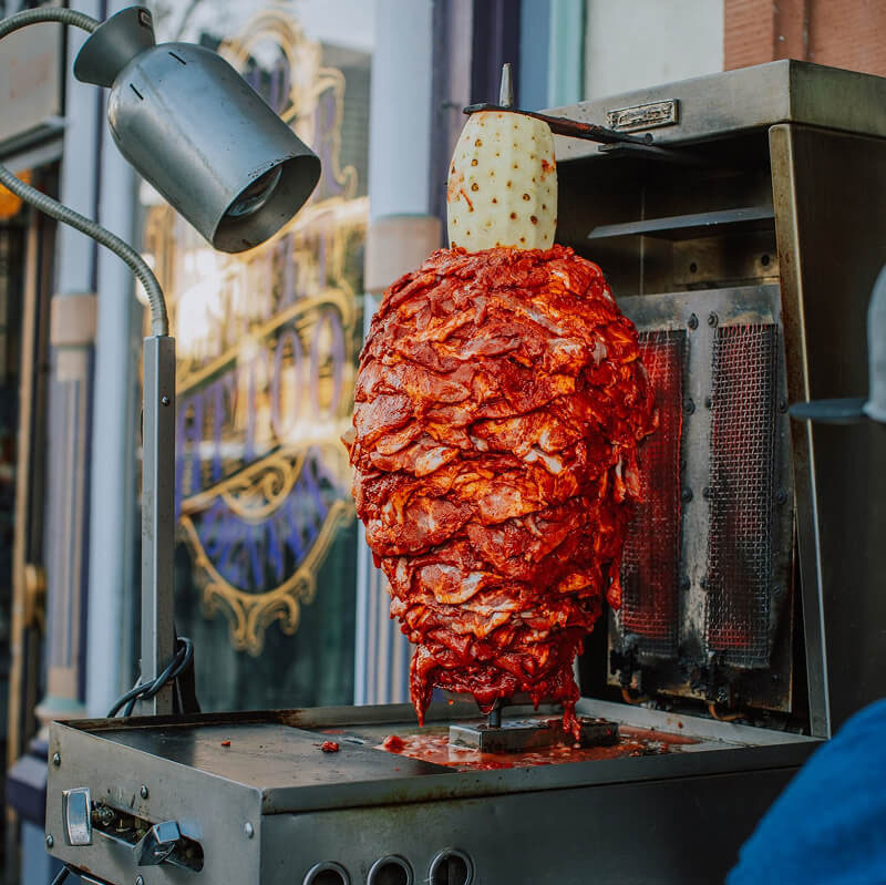 Trompo grilling Al Pastor.